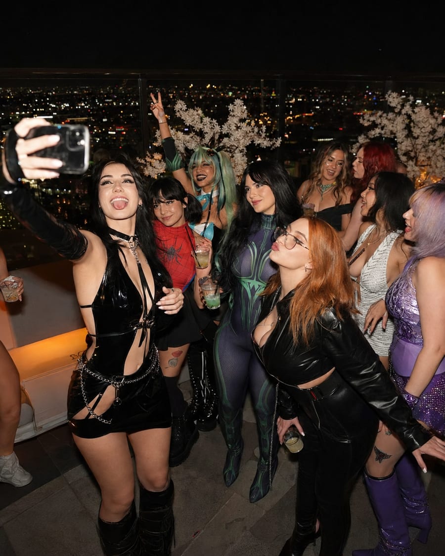 GoBunny creators taking a group selfie together at an evening rooftop meetup